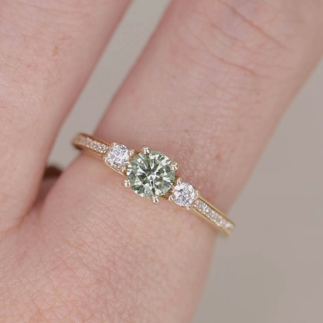 Round green diamond and white diamond pave  yellow gold band engagement ring