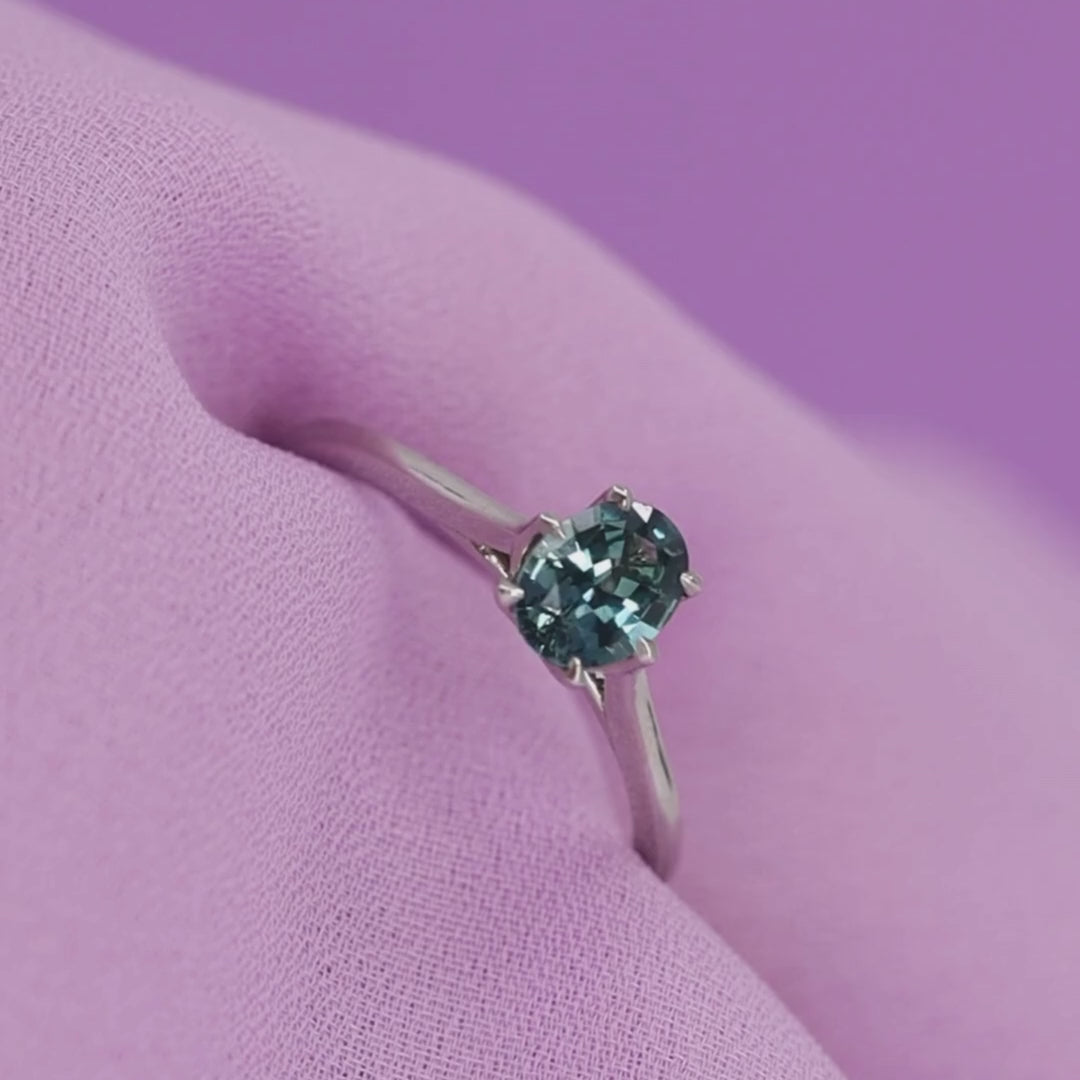 Raine - Oval Cut Teal Sapphire Solitaire Ring with Lotus Flower Inspired Setting in Platinum- Ready-to-Wear