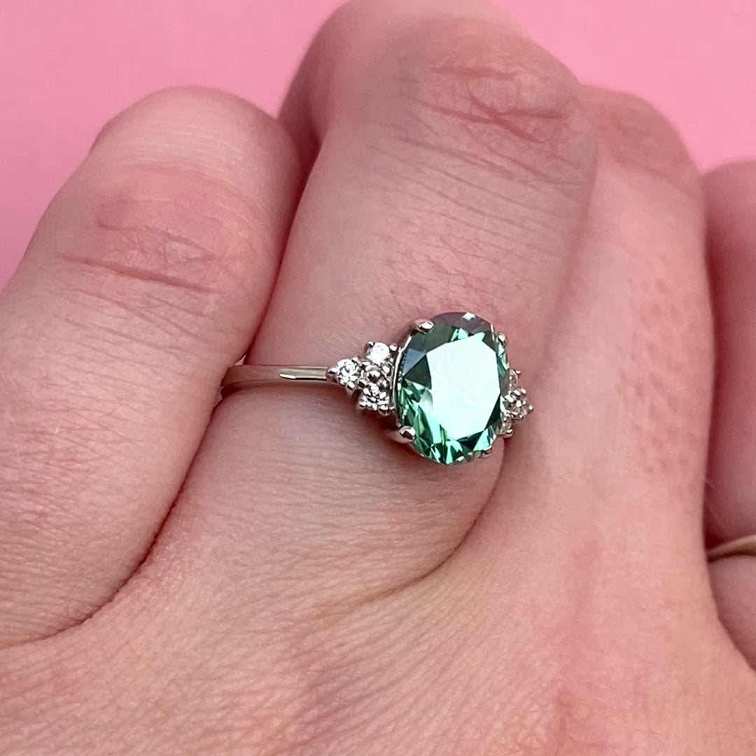 Henrietta - Oval Cut Teal Moissanite Ring with Round Brilliant Cut Diamond Side Stones - Custom Made-to-Order Design