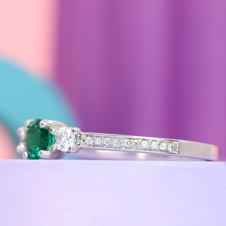 Callie - Round Brilliant Cut Emerald Trilogy Engagement Ring - Made-to-Order