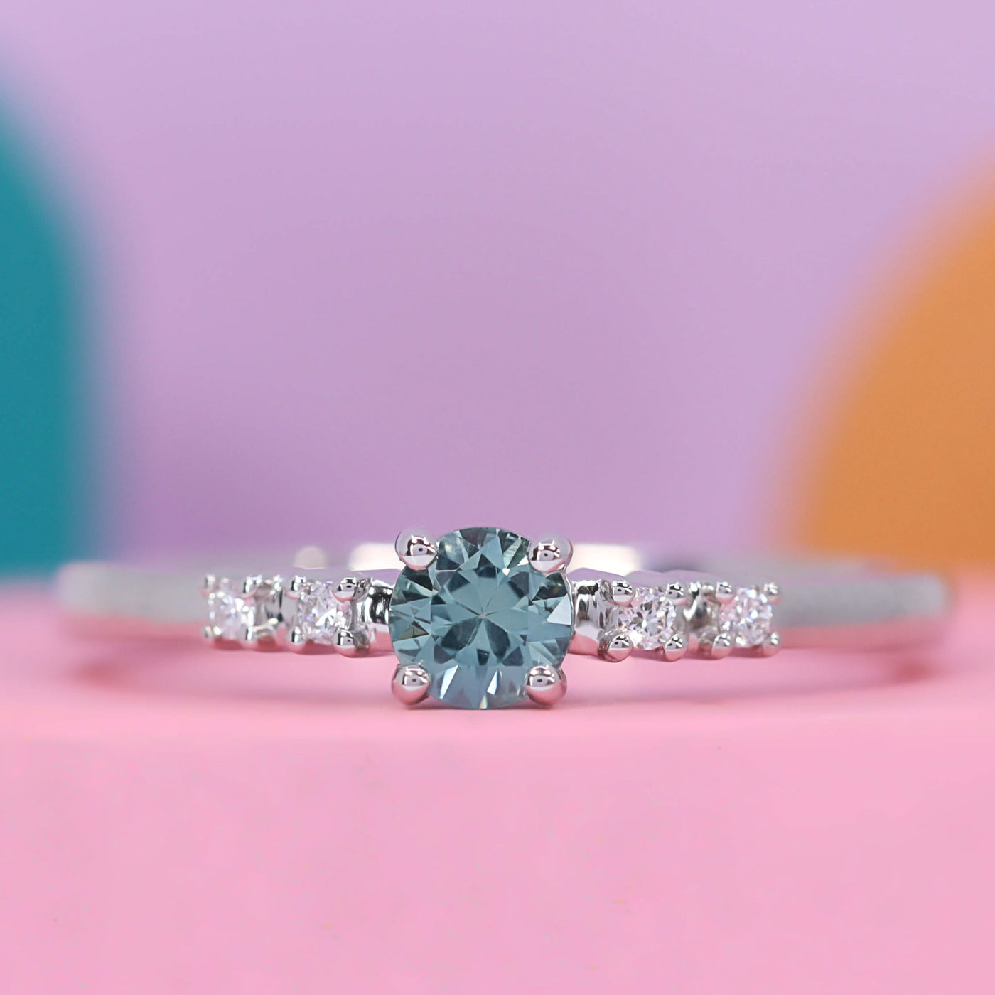 Lucie - Dainty Deco Collection - Round Brilliant Cut Teal Sapphire Engagement Ring with Diamond Set Shoulders - Made-to-Order